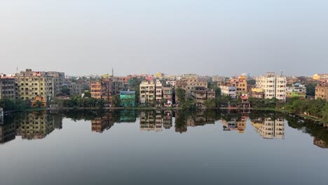 top view of rows of buildings beside a lake in kolkata, india