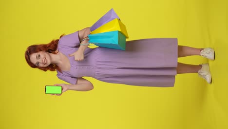 woman with shopping bags and phone