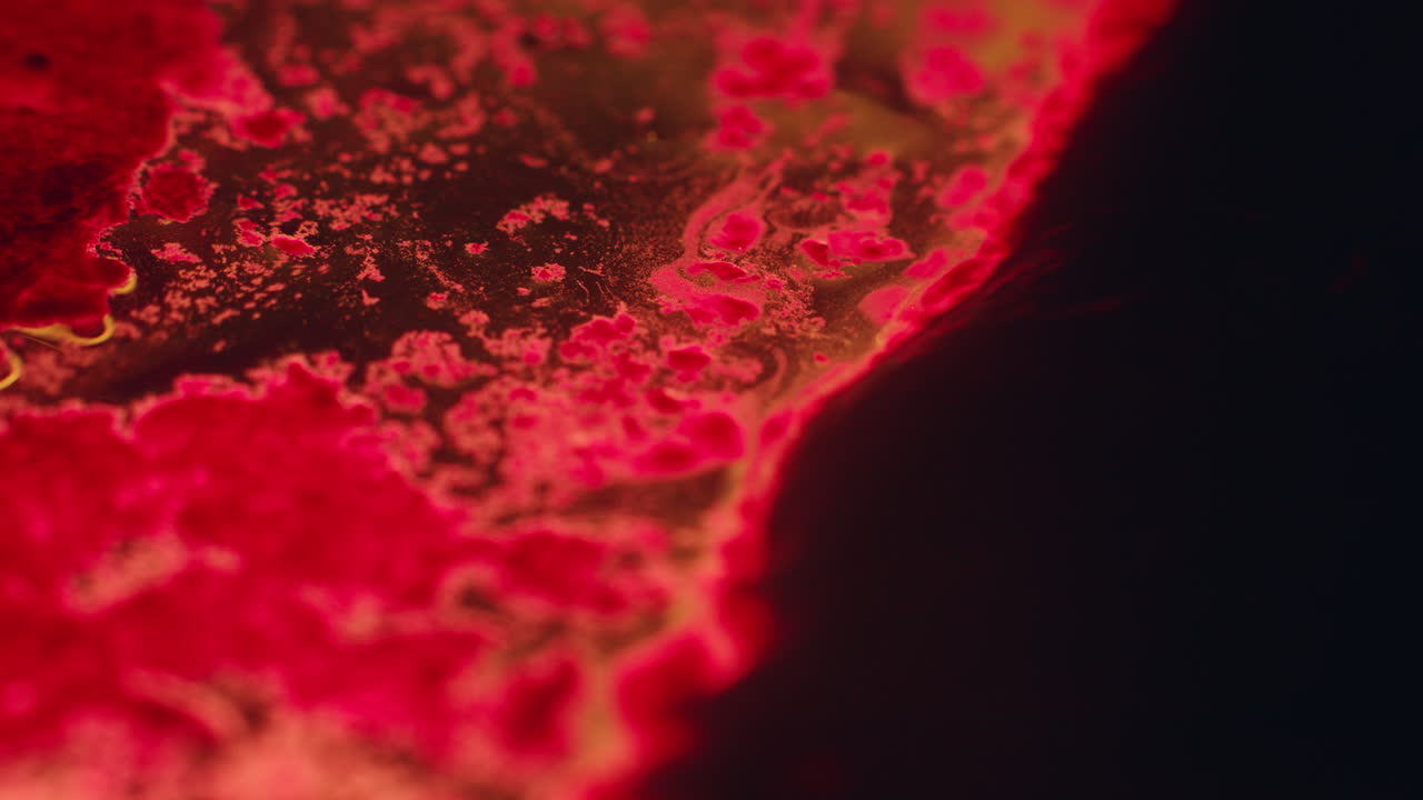 Colourful, organic, liquids macro shots buzzing and flowing