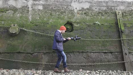 cameraman filming with gimbal, wide angle