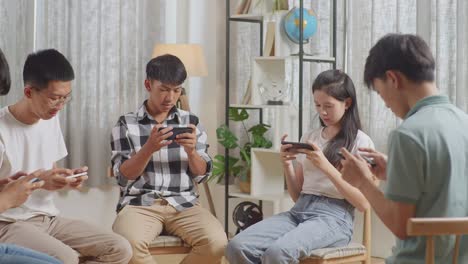 group of teenagers using smartphones