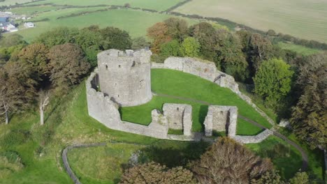 Aerial-view-of-Dundrum-Castle-on-a-sunny-day,-County-Down,-Northern-Ireland