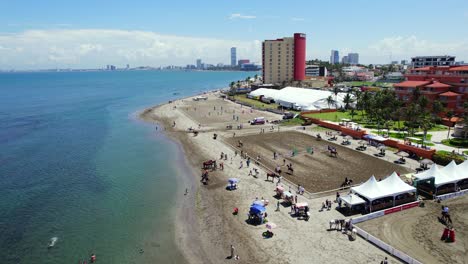 Aerial-view-of-an-equestrian-show-jumping-event-on-the-beach