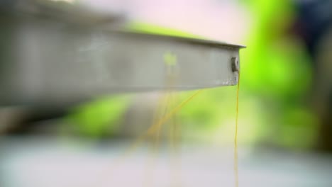 macro shot of a sewing machine during production of textile manufacturing