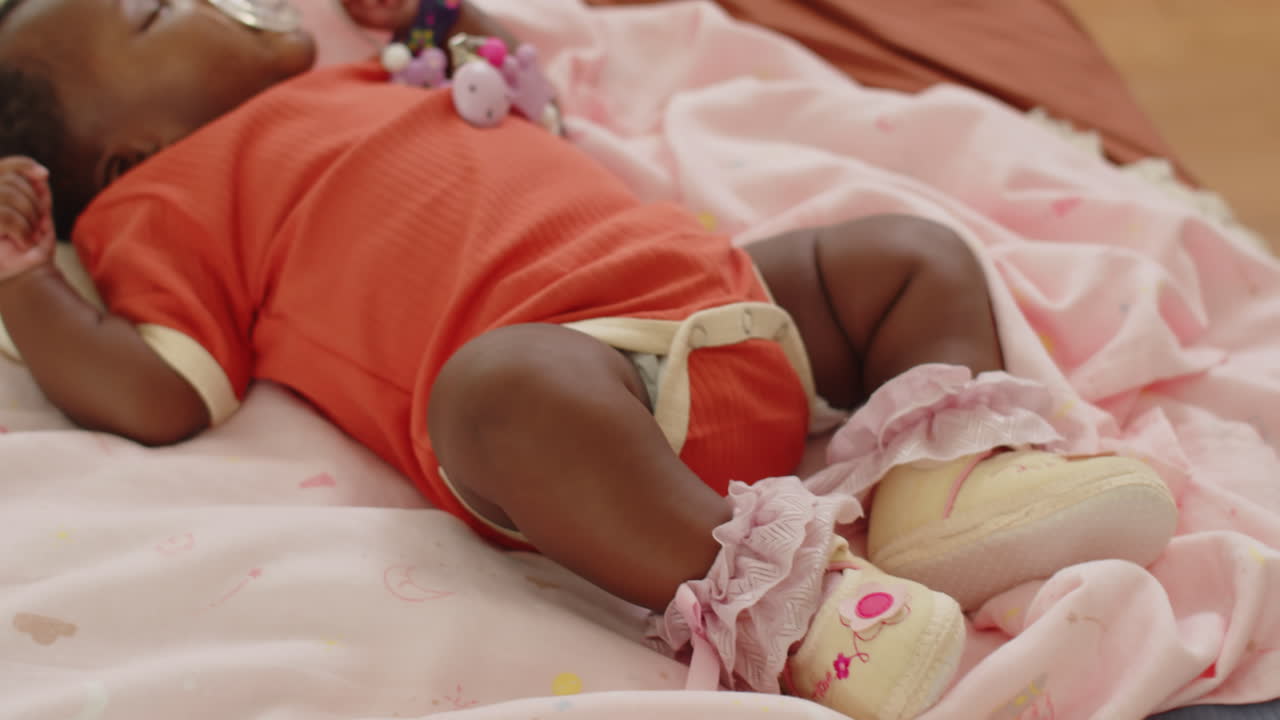 Cute Newborn Sleeping in Bed