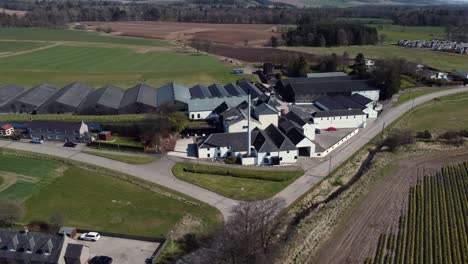 aerial view of fettercairn whisky distillery on a sunny spring day, aberdeenshire, scotland