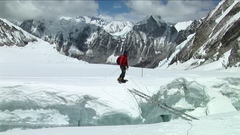 Climber-crosses-large-crevasse-above-camp-one