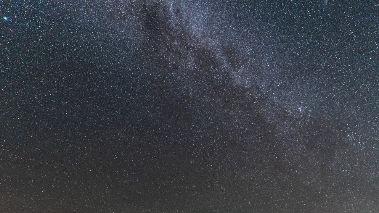 Stars Shining Brightly Move Slowly Across the Night Sky in Time Lapse Clip
