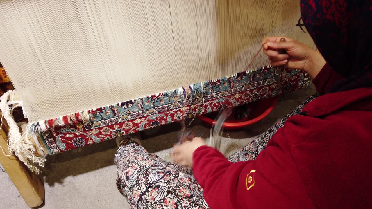 Woman Weaving a Traditional Turkish Carpet