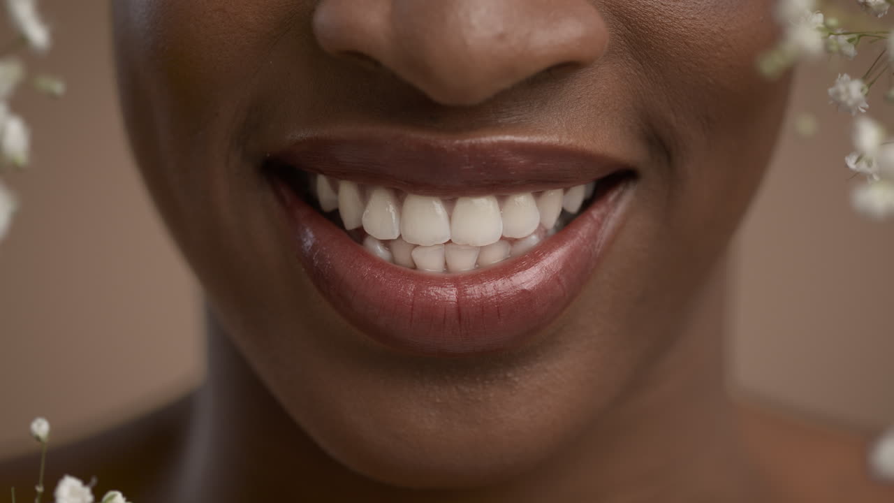 Close-up of a woman smiling with flowers