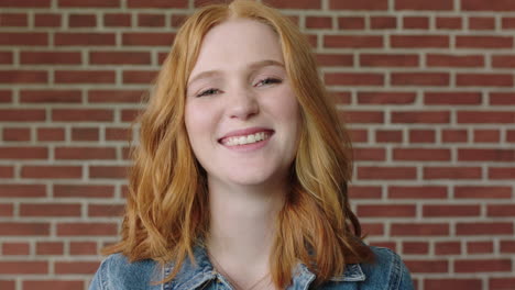 portrait of beautiful red head woman smiling cheerful feeling optimistic student indoors