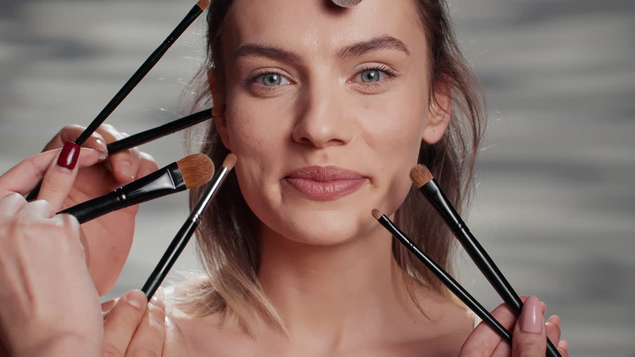 Woman with Makeup Brushes