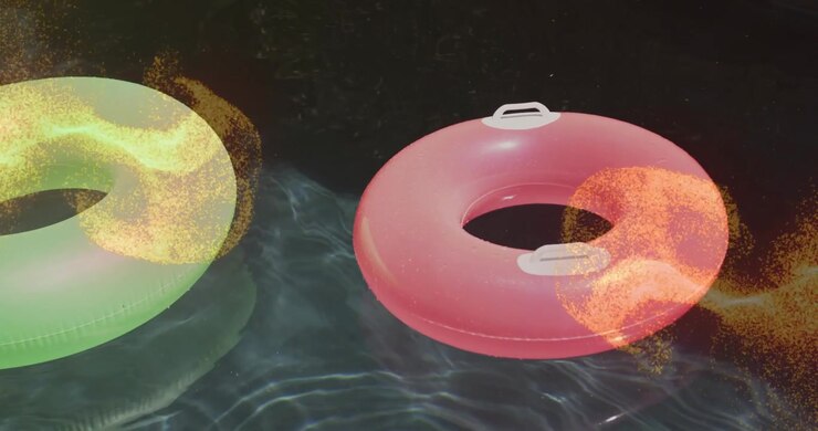 Golden currents materializing around green red tubes, swirling fading to accent drifting on water