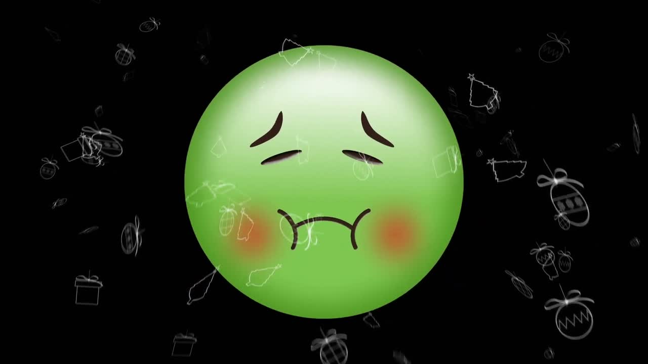 검은색 배경에 움직이는 크리스마스 아이콘 위에 아픈 이모지 아이콘의 애니메이션