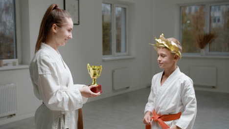 pupil and teacher in white kimono in martial arts class