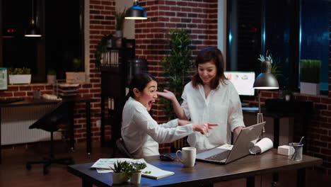 Employee-and-coworker-celebrating-positive-feedback-from-management