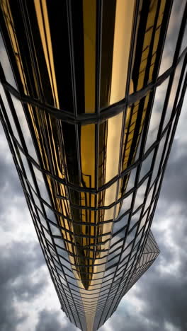 modern skyscraper facade with golden reflections