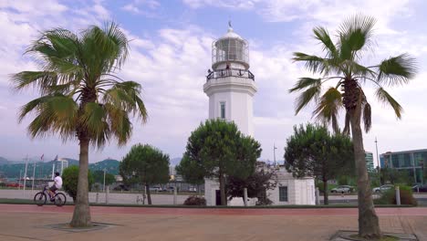 lighthouse and palms on the boulevard