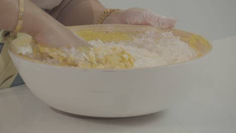 Kneads-the-bread-dough-to-make-it-smooth