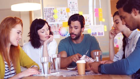 business colleagues discussing over a document