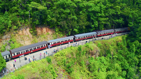 Tourists-Aboard-The-Train-Walking-Along-Kuranda-Scenic-Railway-In-Barron-Gorge-National-Park-In-QLD,-Australia