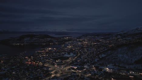 aerial view of a snowy city at night