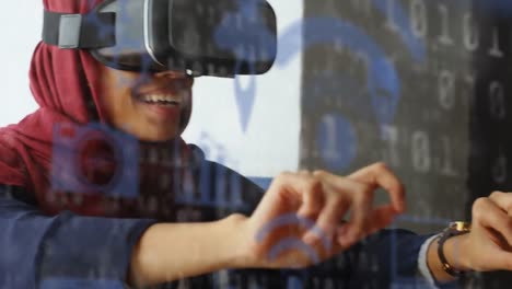 Animation-of-data-processing-and-social-media-icons-over-mixed-race-woman-wearing-vr-headset