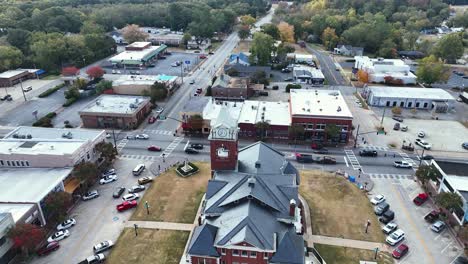 the town of jackson in the state of ga used for stranger things as "downtown hawkins" part 3 - buildings and transit driving by and parked during morning time