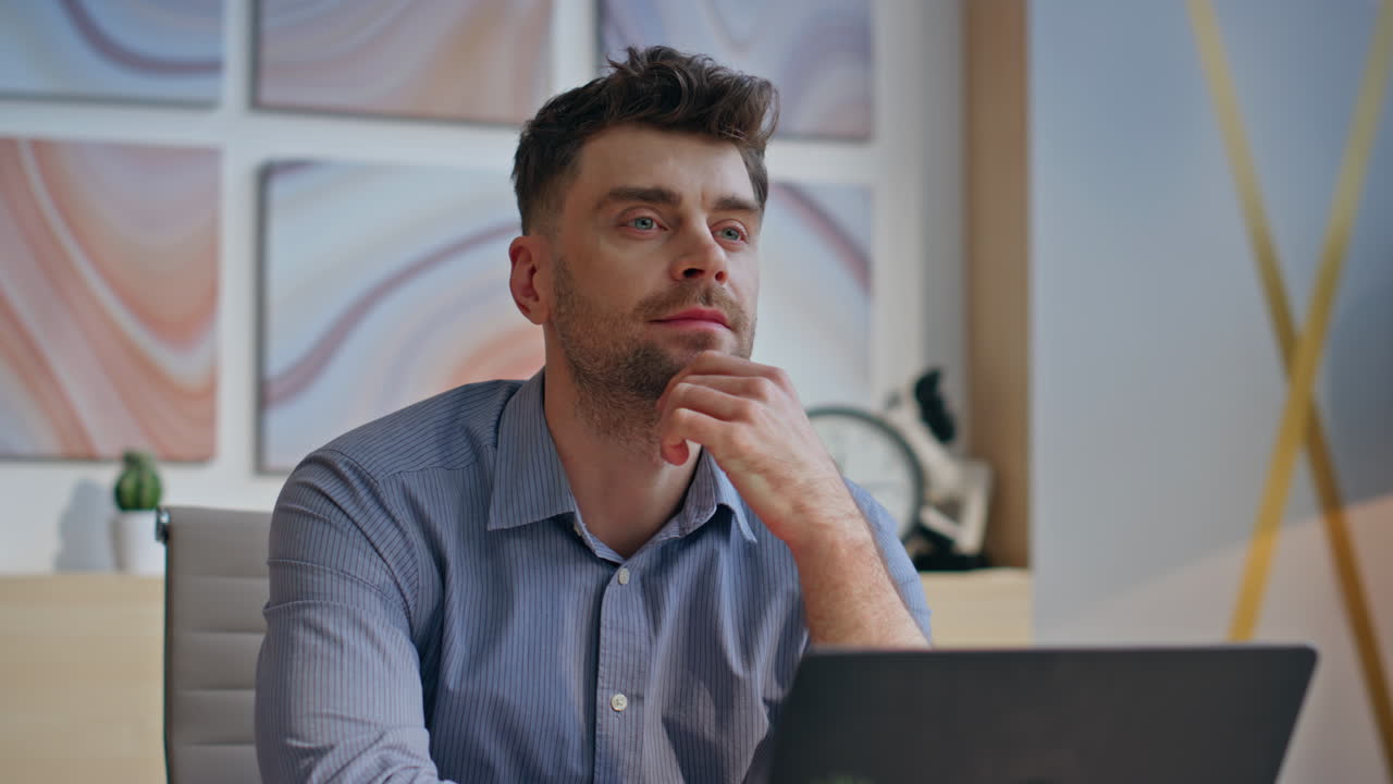 Thoughtful businessman pondering project looking distance in office closeup