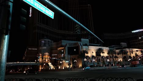 las vegas boulevard strip at night during coronavirus pandemic outbreak. closed palazzo and venetian in dark and street traffic