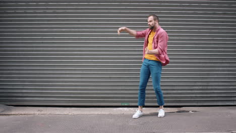 contemporary funky caucasian man street dancer dancing freestyle in the city