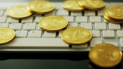 golden bitcoins on keyboard