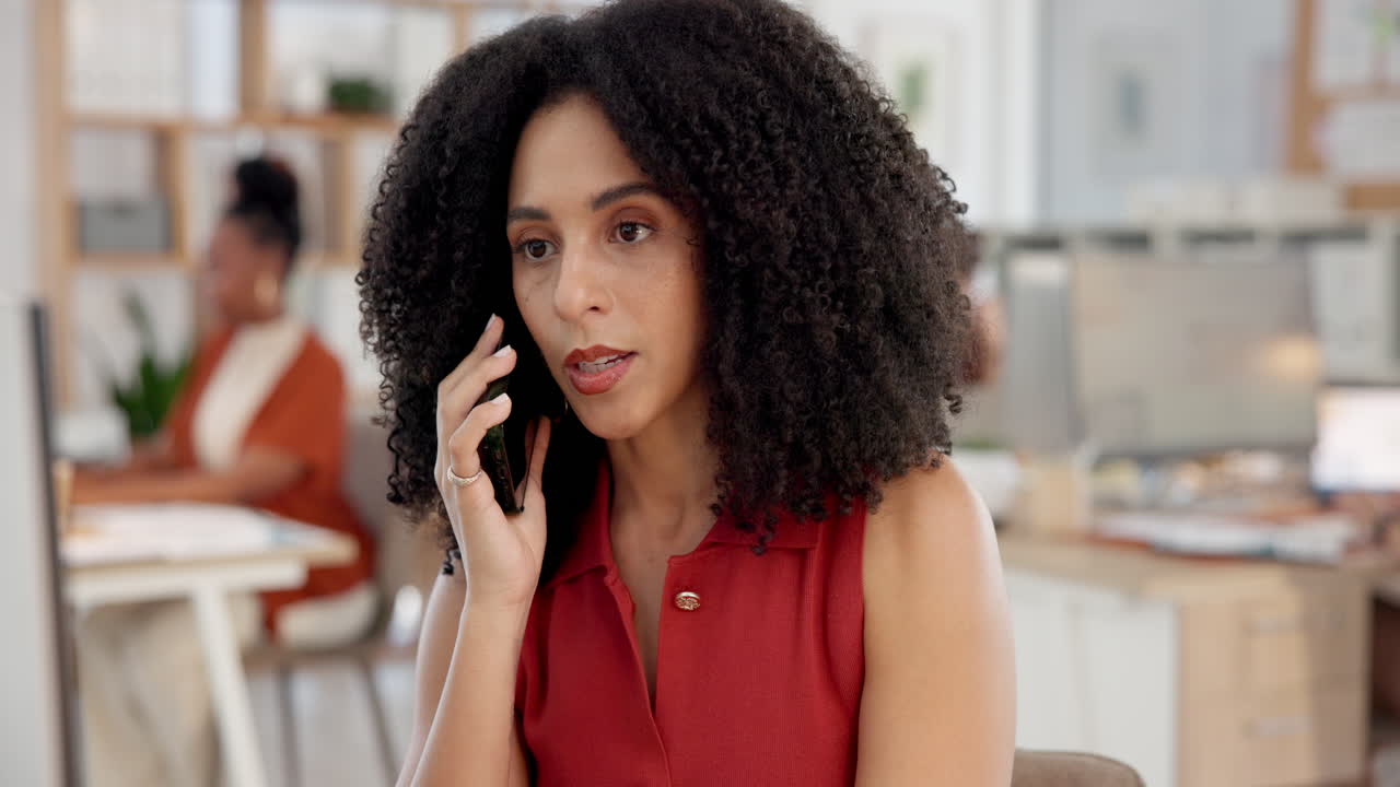 Professional Woman Talking on Smartphone in a Modern Office