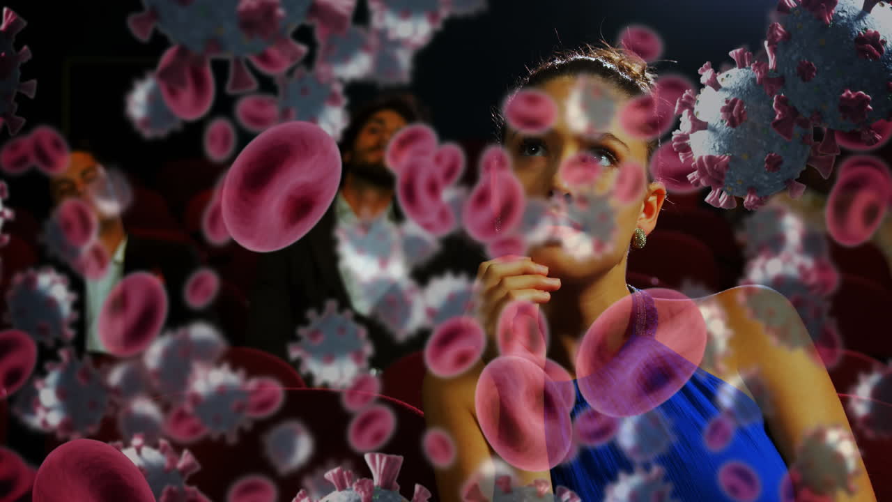 células de covid-19 y vasos sanguíneos contra mujer viendo una película en el cine