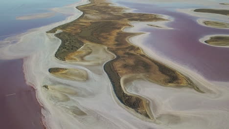 drone panning down over beautiful pink lake tyrrell, australia