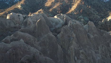 Rock-formations-at-Devil's-Punchbowl-in-golden-hour-light,-creating-dramatic-shadows