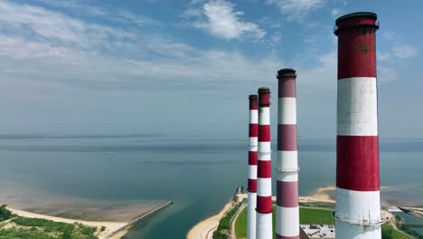 An-aerial-view-of-a-large-power-plant-on-a-sunny-day-with-blue-skies-and-white-clouds-1