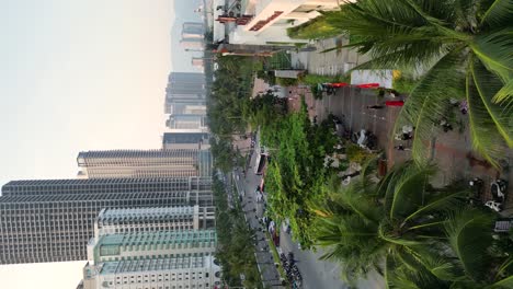 people strolling along the picturesque promenade in da nang, vietnam - vertical shot