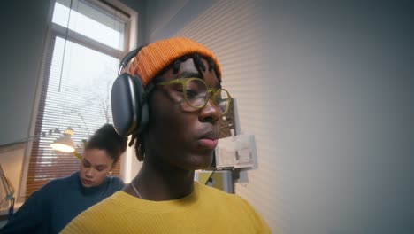 teenage student studying with headphones