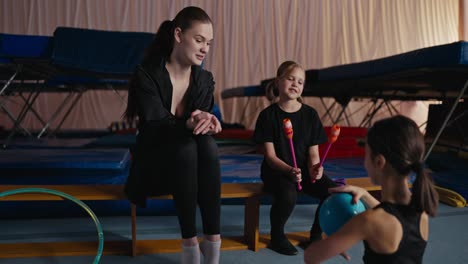 young gymnasts training with their coach