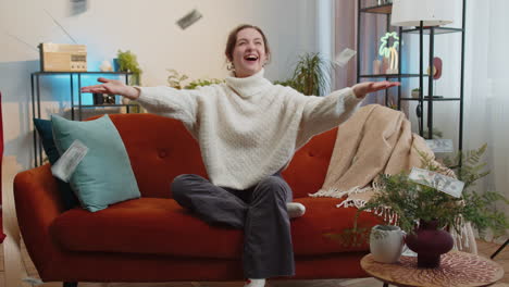 money cash dollar rain falling on girl celebrating success winning good news lottery jackpot luck