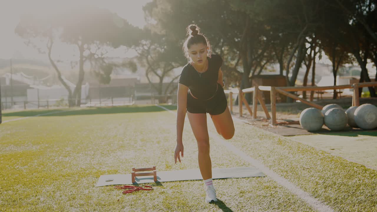 Woman stretching outdoors on a sunny morning
