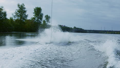 Rider-falling-from-wakeboard-into-river.-Sportsman-failing.-Fall-on-water