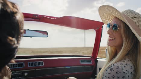 rear view video of happy couple driving a car