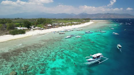 boats floating in the coastal beach of gili meno