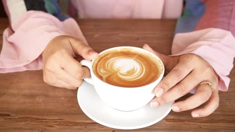 woman enjoying a coffee in a cafe