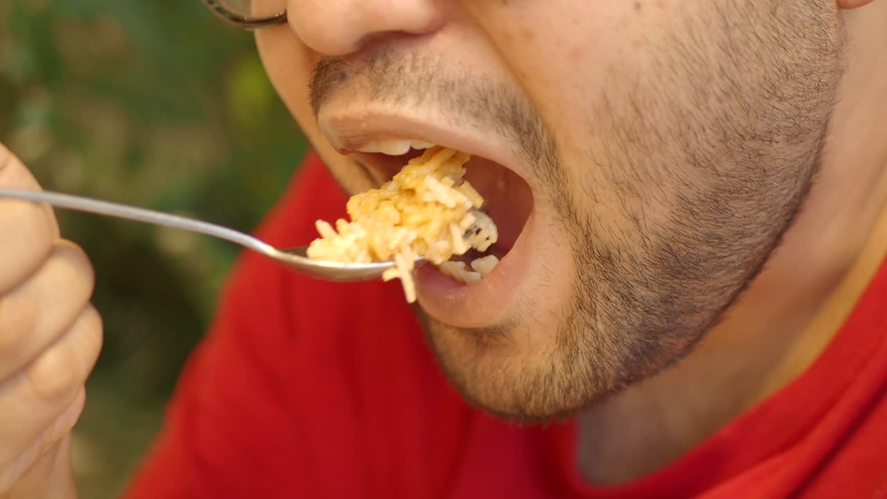 Man eating with a spoon