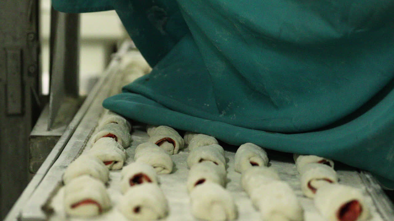 Covering Bread Dough On A Tray With Cloth While Rising To Keep It From Drying Out - close up