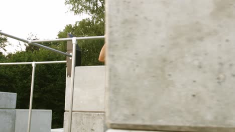 muscular black guy in outside callisthenics park training pull up exercise