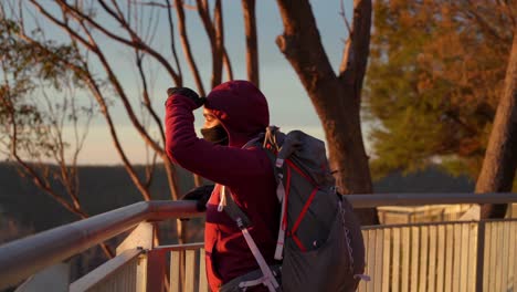 indigenous australian girl looking out over the blue mountains during a sunny winter morning